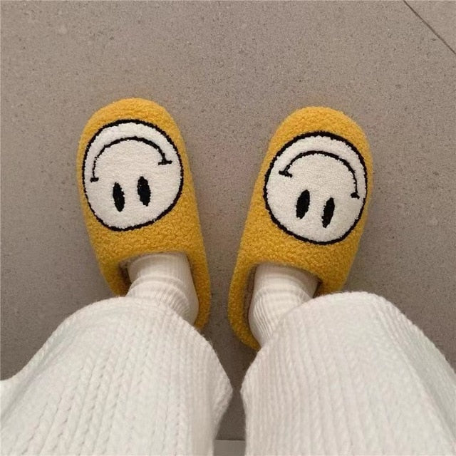 MEGA SMILEY FACE FUZZY SLIPPERS